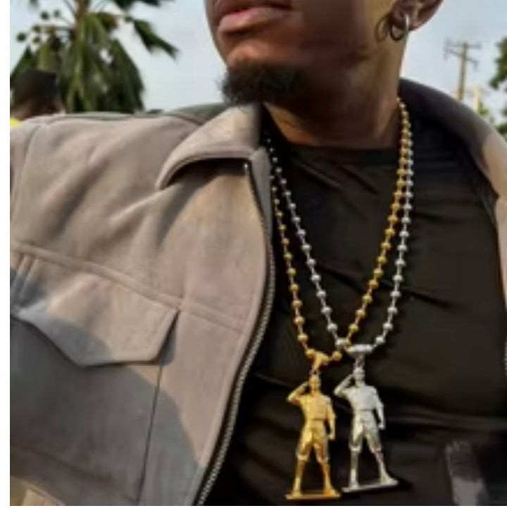 Gold and silver soldier pendant ball chain necklaces worn together